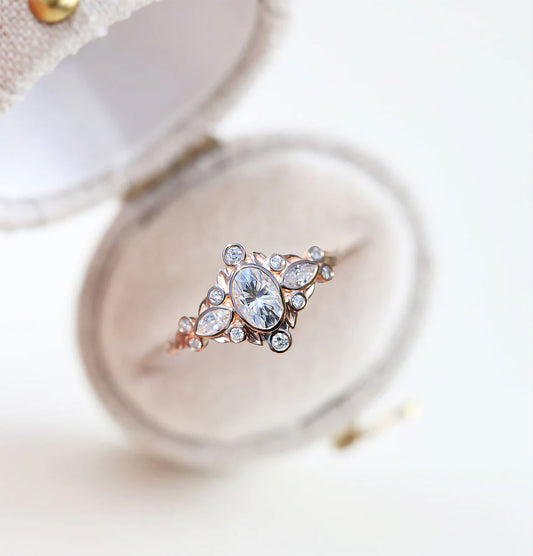 Unique Briar Bezel Three Stone Oval Moissanite Ring