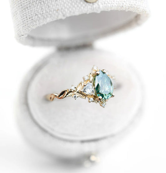 Unique Celeste Rose Three Stone Pear Teal Moissanite Ring