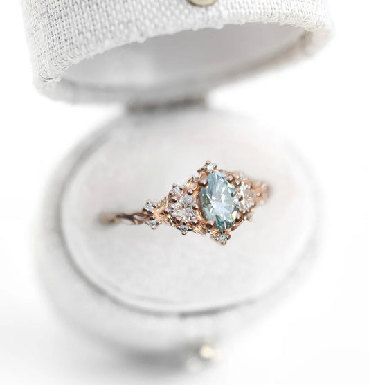 Unique Celeste Rose Three Stone Oval Teal Moissanite Ring