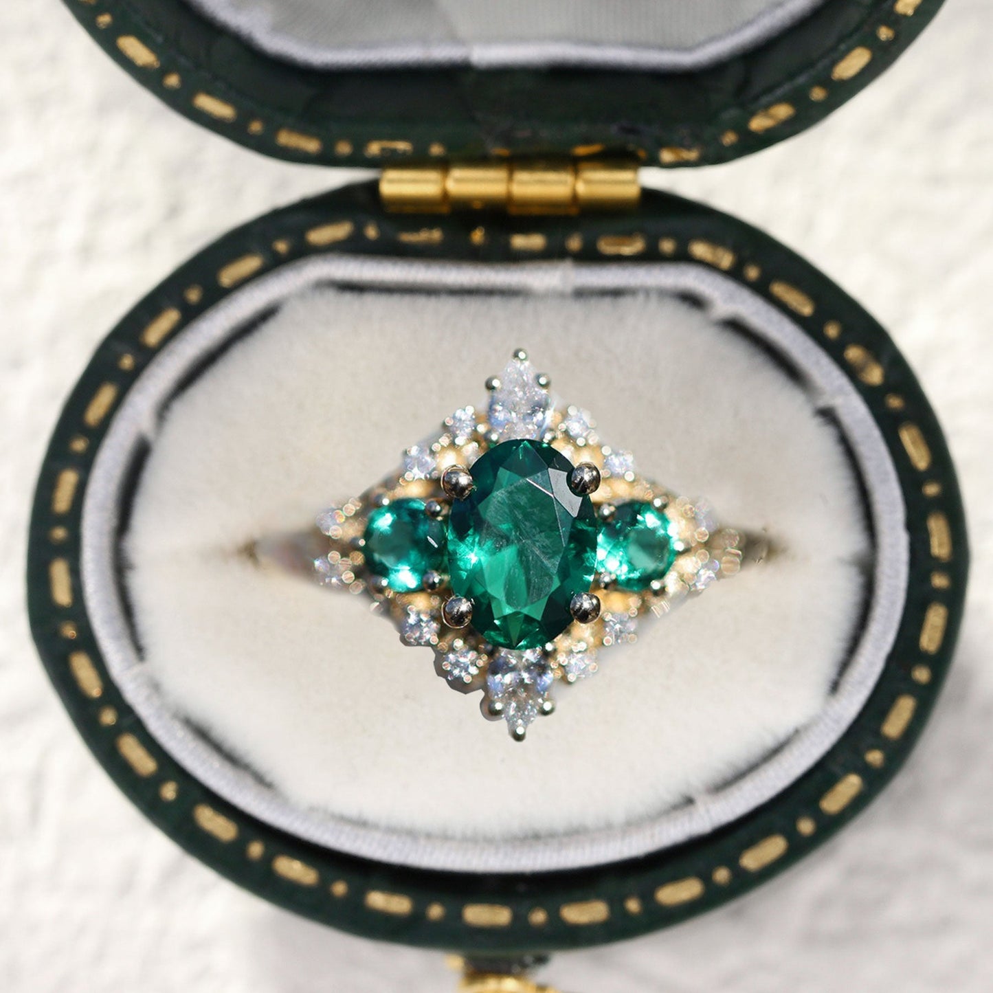 Unique Enchanted Three Stone Oval Lab Emerald Ring