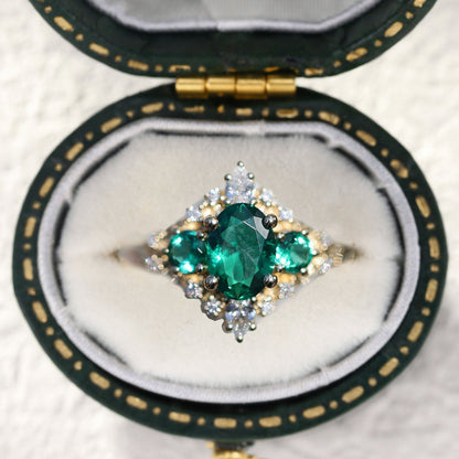 Unique Enchanted Three Stone Oval Lab Emerald Ring