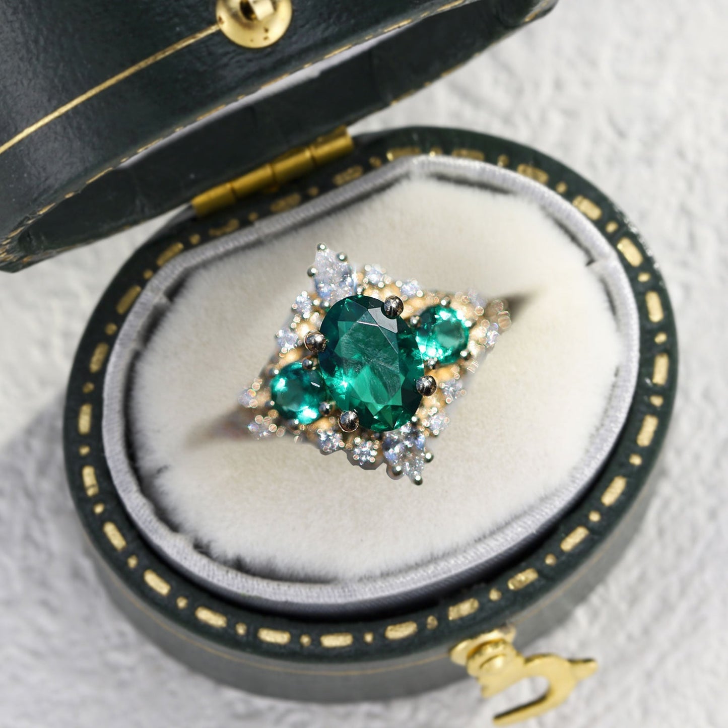 Unique Enchanted Three Stone Oval Lab Emerald Ring