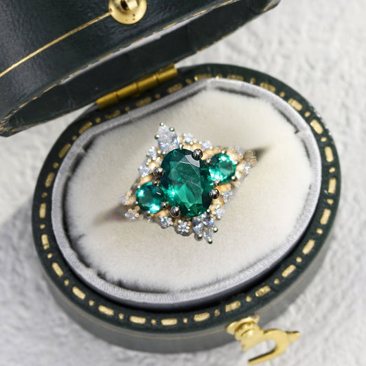 Unique Enchanted Three Stone Oval Lab Emerald Ring