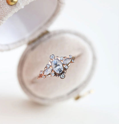 Unique Briar Bezel Three Stone Oval Moissanite Ring