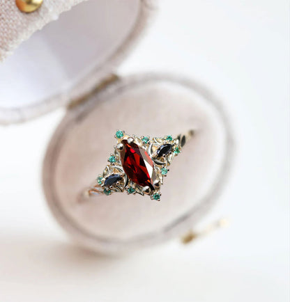 Unique Briar Moon Three Stone Marquise Garnet and Lab Emerald Ring