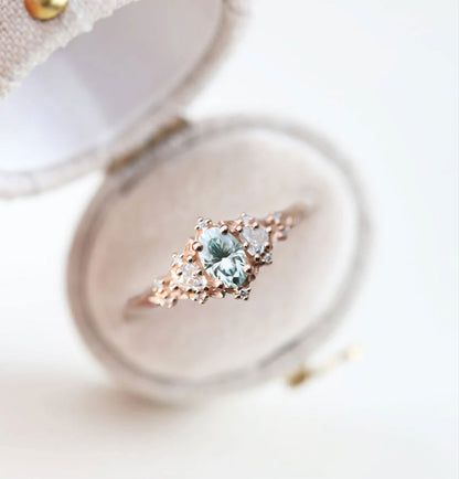 Unique Celeste Rose Three Stone Oval Teal Moissanite Ring
