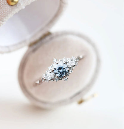 Unique Celeste Rose Three Stone Round Grey Blue Moissanite Ring