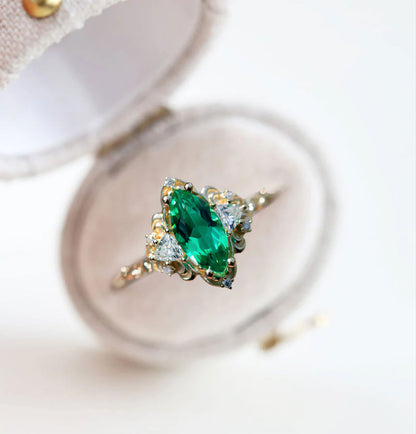 Unique Aurora Three Stone Marquise Lab Emerald Ring