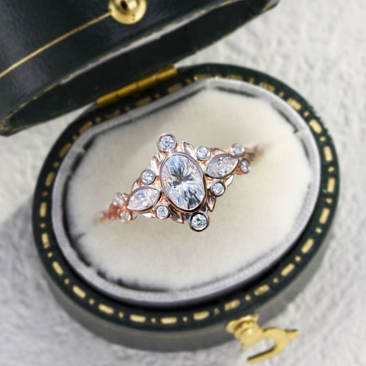 Unique Briar Bezel Three Stone Oval Moissanite Ring
