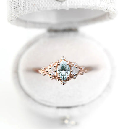 Unique Celeste Rose Three Stone Oval Teal Moissanite Ring