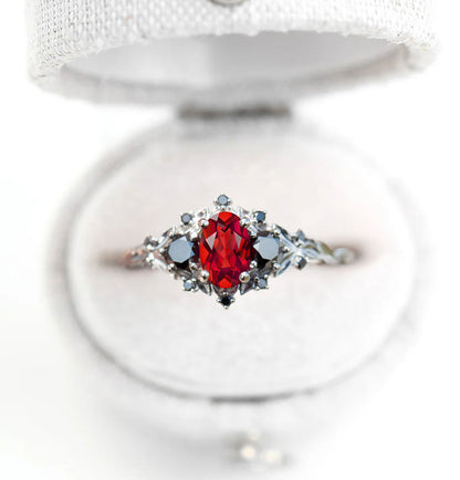 Unique Celeste Rose Three Stone Oval Garnet and Black Moissanite Anniversary Ring