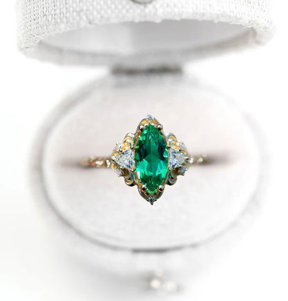 Unique Aurora Three Stone Marquise Lab Emerald Ring