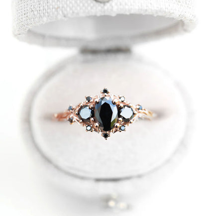 Unique Celeste Rose Three Stone Oval Black Moissanite Ring