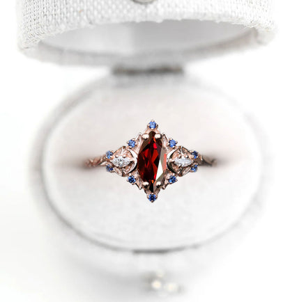 Unique Briar Moon Marquise Garnet and Lab Blue Sapphire Anniversary Ring