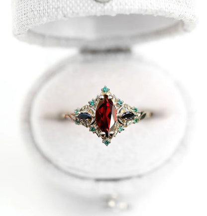 Unique Briar Moon Three Stone Marquise Garnet and Lab Emerald Ring
