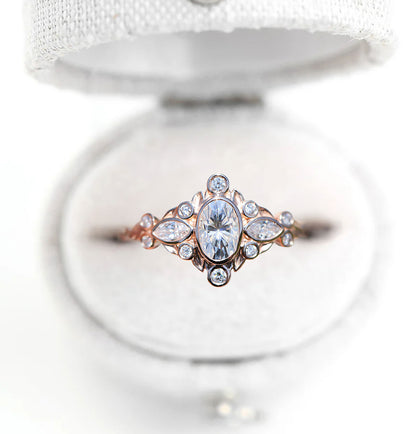 Unique Briar Bezel Three Stone Oval Moissanite Ring