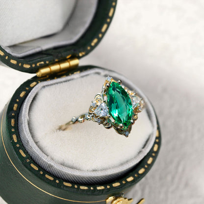 Unique Aurora Three Stone Marquise Lab Emerald Ring