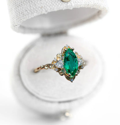 Unique Aurora Three Stone Marquise Lab Emerald Ring