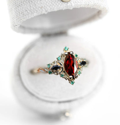 Unique Briar Moon Three Stone Marquise Garnet and Lab Emerald Ring