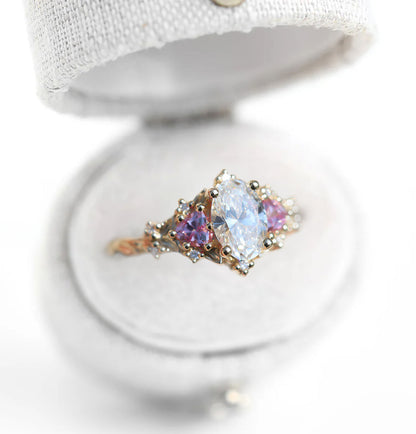 Unique Celeste Rose Three Stone Oval Moissanite and Lab Pink Sapphire Ring