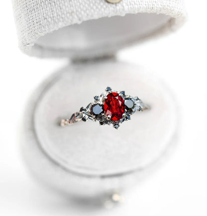 Unique Celeste Rose Three Stone Oval Garnet and Black Moissanite Anniversary Ring