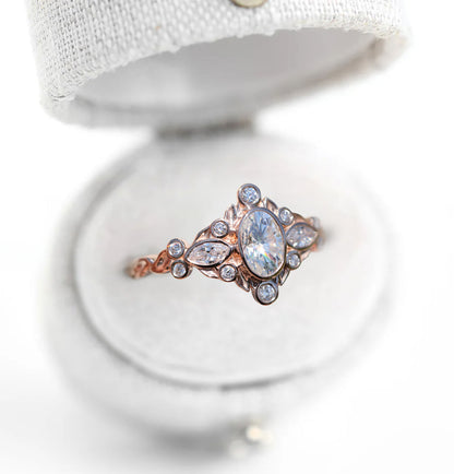 Unique Briar Bezel Three Stone Oval Moissanite Ring