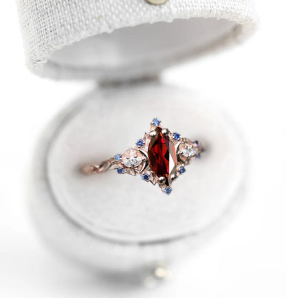 Unique Briar Moon Marquise Garnet and Lab Blue Sapphire Anniversary Ring