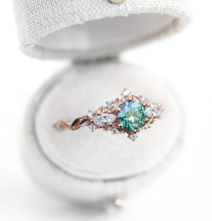 Unique Celeste Rose Three Stone Round Teal Moissanite Ring