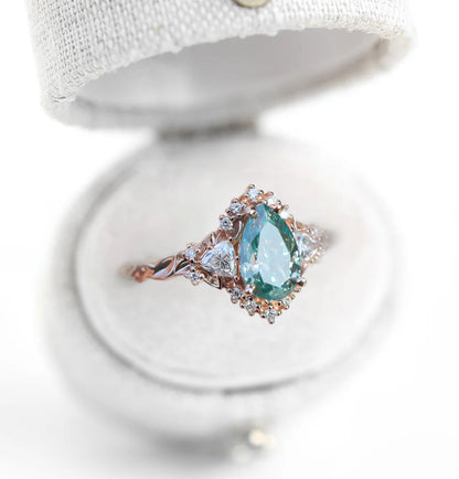 Unique Briar Half Halo Pear Teal Moissanite Ring