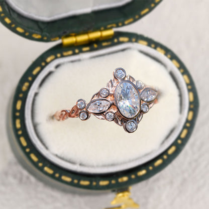 Unique Briar Bezel Three Stone Oval Moissanite Ring