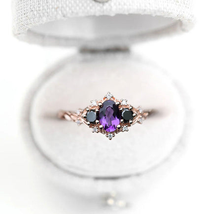 Unique Celeste Rose Three Stone Oval Amethyst and Black Moissanite Ring