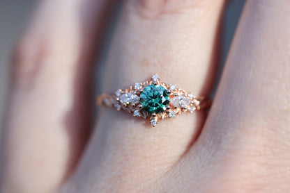 Unique Celeste Rose Three Stone Round Teal Moissanite Ring