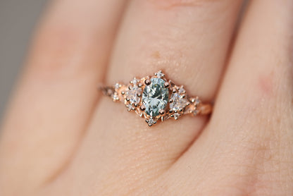 Unique Celeste Rose Three Stone Oval Teal Moissanite Ring